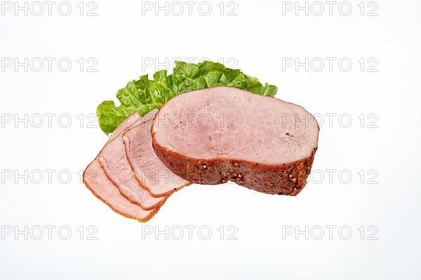 Smoked beef and greenery on an isolated studio background