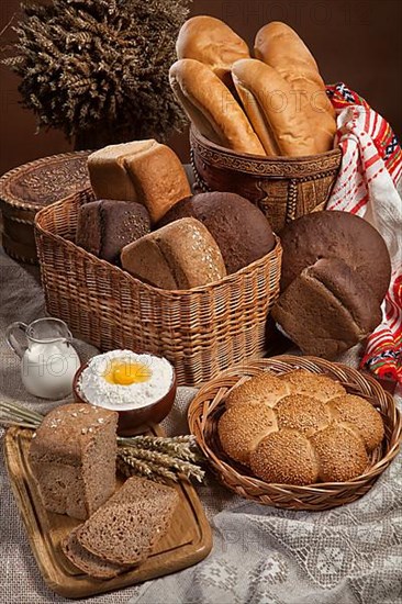 Still life with different kinds of bread on a tablecloth