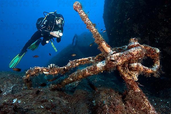 Diver and old anchor