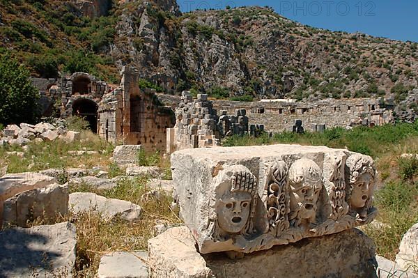 Theatre masks carved in stone