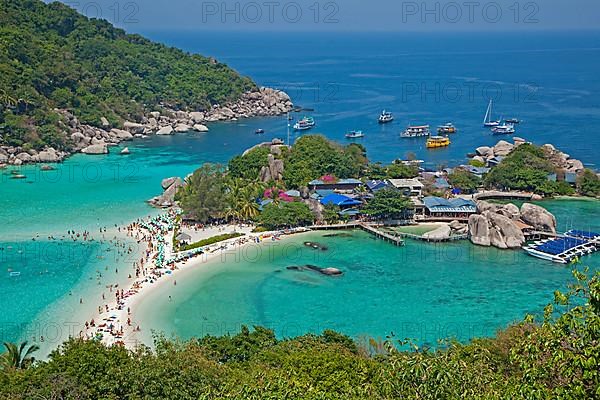 Western tourists sunbathing on the beach of Ko Nang Yuan