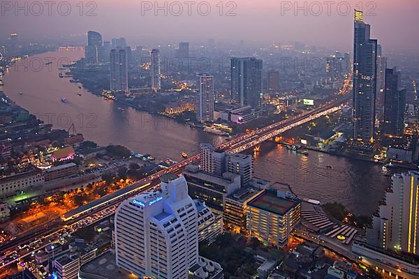 The Bangkok skyline at night and view of the Chao Phraya River