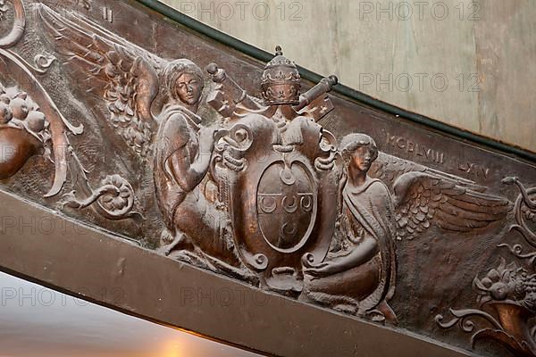 Papal coat of arms on staircase banister