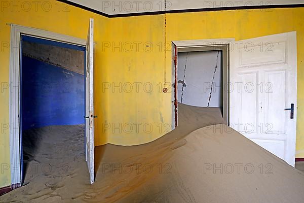 Residential buildings taken over by desert sand