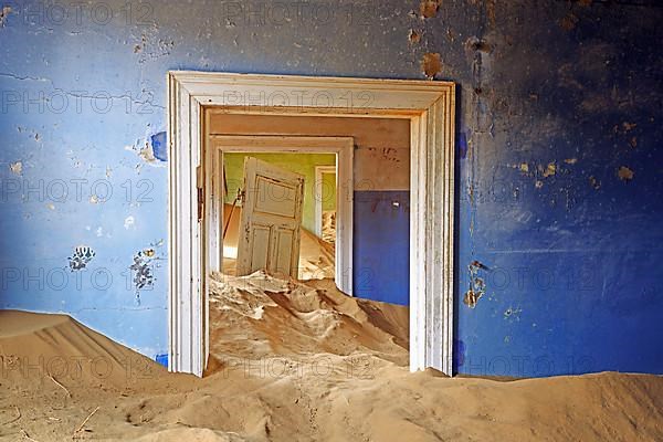 Residential buildings taken over by desert sand