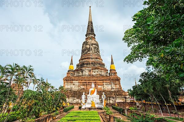 Buddha statues in front of the stupa at Wat Yai Chai Mongkhon