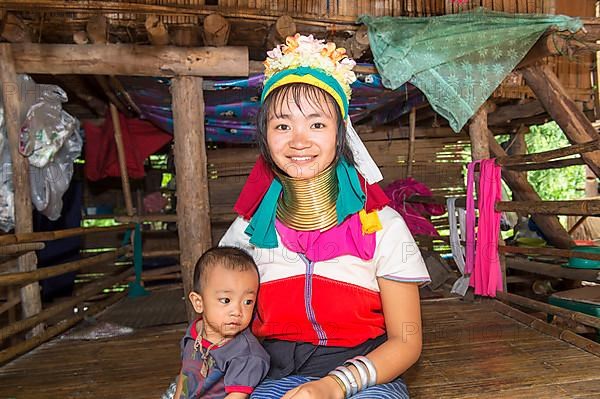 Long-necked woman with her baby