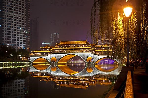 Illuminated Anshun Bridge over the Jin River at night in the provincial capital Chengdu