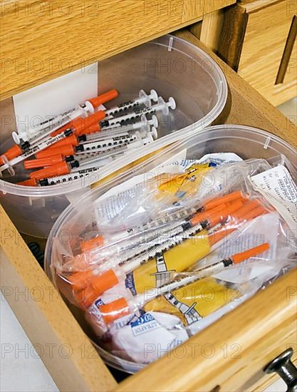 Drawer with insulin syringes for diabetic domestic cats