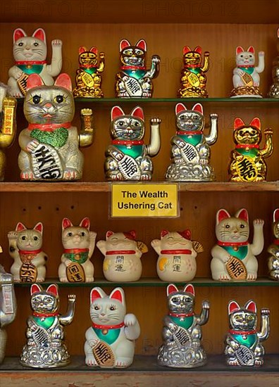 Waving cats