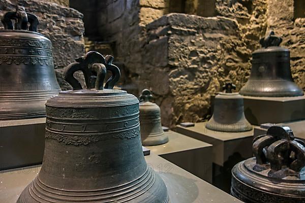 Old carillon bells in the Museum in the Bell Tower in Ghent