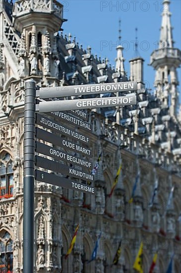Signpost in front of the Gothic Town Hall at the Grote Markt