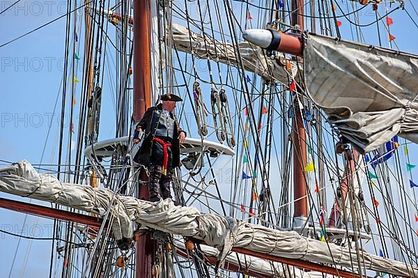 Buccaneer captain overlooking the sea from the mast during the maritime festival Oostende voor Anker