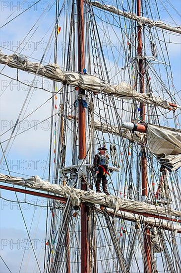 Buccaneer captain overlooking the sea from the mast during the maritime festival Oostende voor Anker