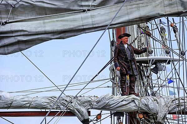 Buccaneer captain overlooking the sea from the mast during the maritime festival Oostende voor Anker