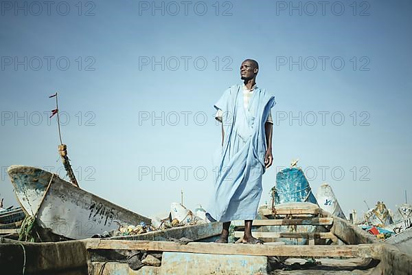 Fisherman Kabir Sidi M'Barek on his boat