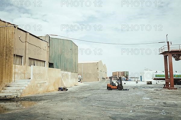 Two workers at the factory during afternoon prayers