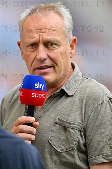 Coach Christian Streich SC Freiburg SCF interview with microphone