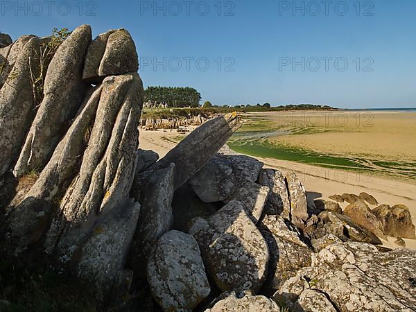 Megaliths at the edge of the intertidal zone on the beach of Guisseny in Brittany
