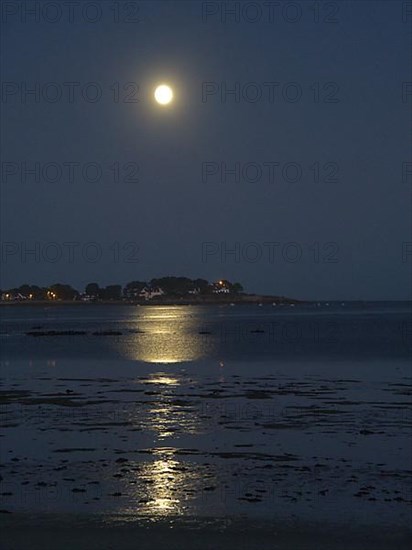 Full moon over the bay of Plouharnel overlooking Pointe Saint Colomban in Brittany