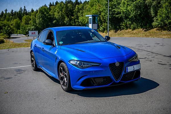 Italian sports car blue Alfa Romeo Giulia Q4 on the premises of driving safety centre FSZ II