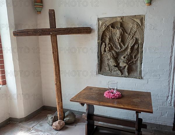 Wooden cross in a side wing of the main Protestant church St. Johannis