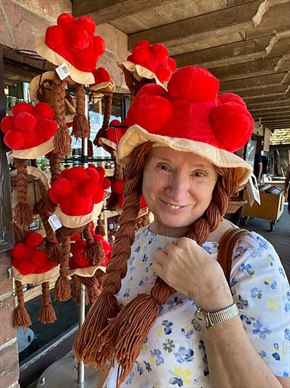 Older woman flirts with fake Bollen hat