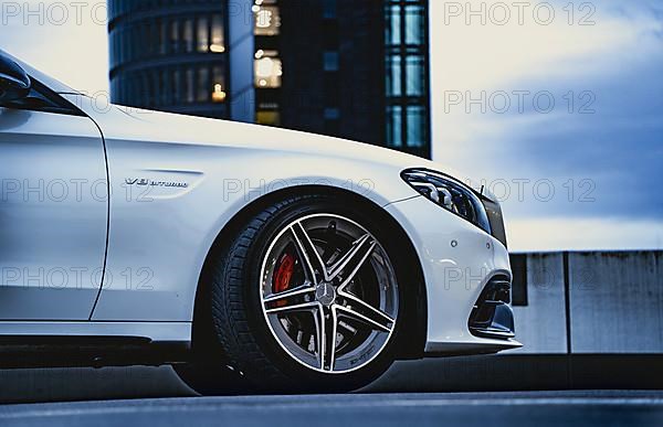 Mercedes AMG with red brake blocks on parking deck