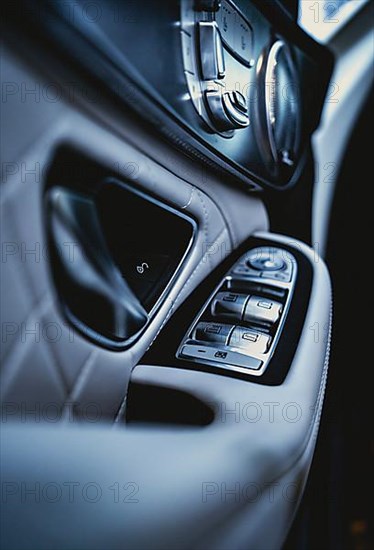 Detail of a vehicle door covered with white leather of a Mercedes AMG