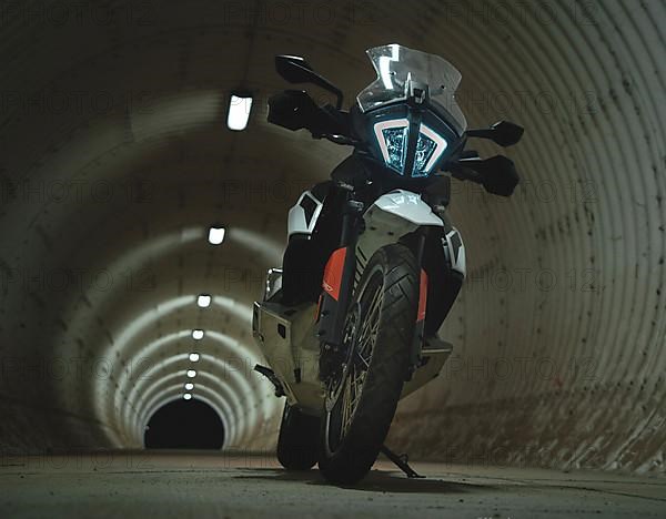 Gloomy shot of a motorbike in a round tunnel