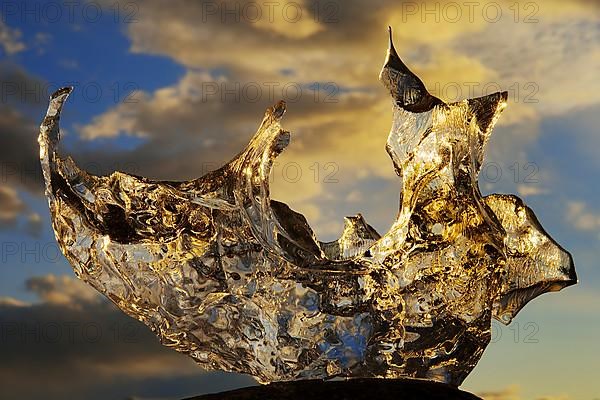 Piece of ice at sunset