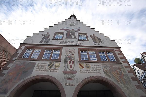 View of the stepped gable of the Renaissance town hall with mural on the market square