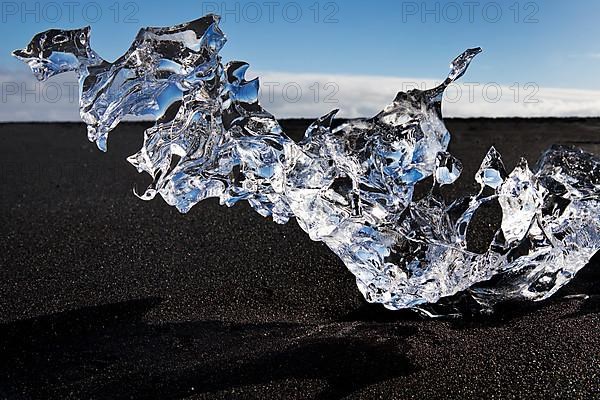 Glacial ice on black beach at Breidarmerkursandur