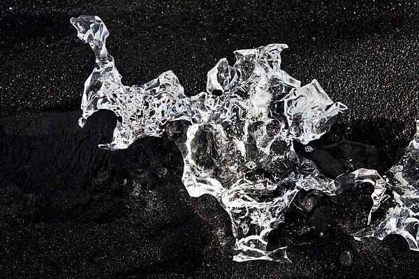 Glacial ice on black beach at Breidarmerkursandur