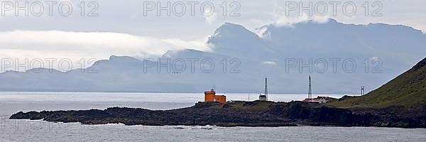 Landscape at Seydisfjoerdur with the lighthouse in Dalatangi