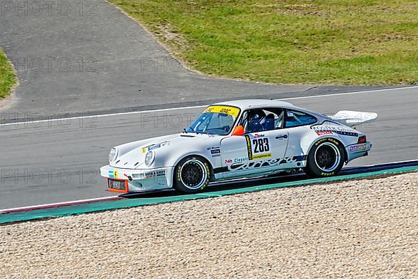 Historic racing car Porsche 911 RS at car racing for classic cars youngtimer classic cars 24-hour race 24h race