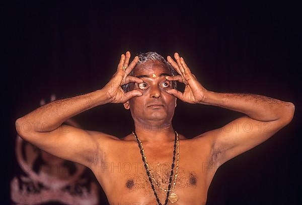 Kalamandalam Gopi demonstrating kathakali Eye exercise in Kerala Kalamandalam