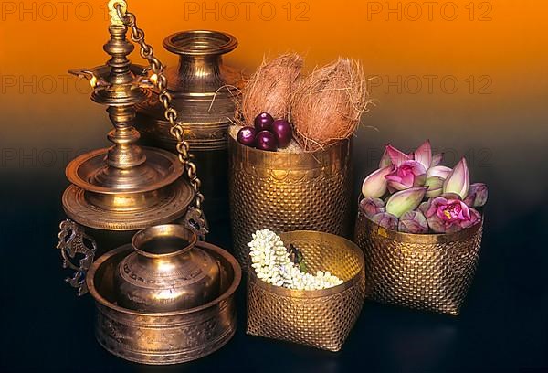 Sacred brass oil lamps and replications of traditionally woven palm-leaf baskets in a Nattukottai Chettiar house