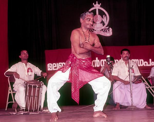 Kalamandalam Gopi demonstrating kathakali exercise in Kerala Kalamandalam