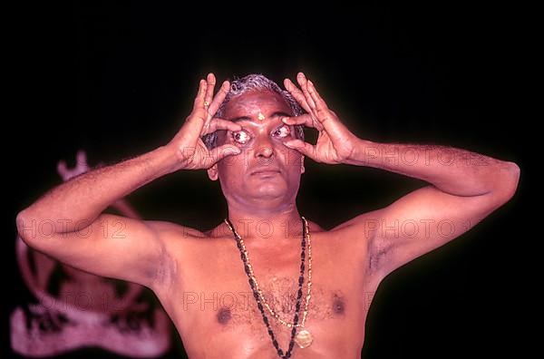 Kalamandalam Gopi demonstrating kathakali Eye exercise in Kerala Kalamandalam