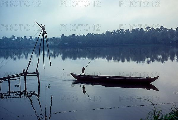 Chinese fishing net and a fishing boat backwaters of Kodungallur