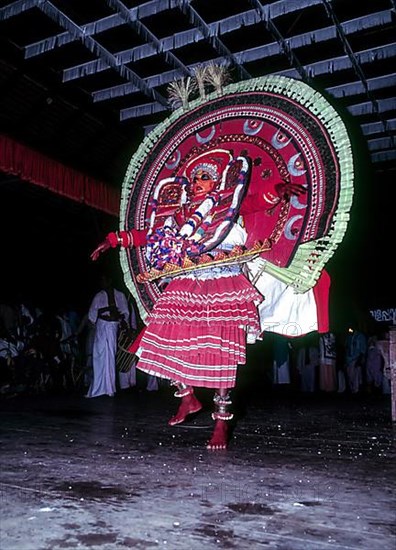Theyyam or Teyyam ritual dance performance in Kerala Kalamandalam Koothambalam temple theatre Cheruthuruthy near Soranur