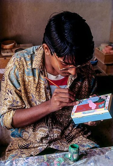 Painting a wooden box at Channapatna a flourishing centre for lac painted wooden toys near Bengaluru Bangalore