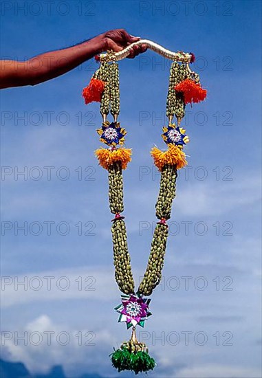 Garland of cardamom being made at Bodi Bodinayakkanur in Tamil Nadu