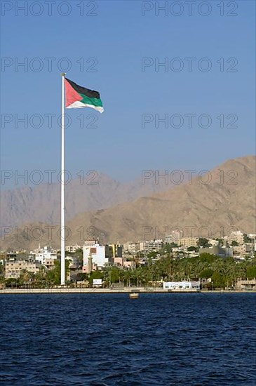 Flagpole with flag of Jordan