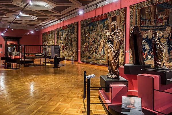 Wooden sculptures and tapestries from the 16th century in the Cinquantenaire Museum in Brussels