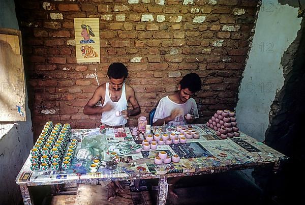 Painting a wooden toy at Channapatna a flourishing centre for lacquerware painted wooden toys near Bengaluru Bangalore