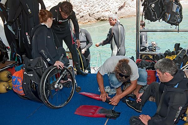 Disabled divers on board diving ship