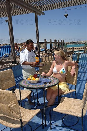 Young woman in pool bar