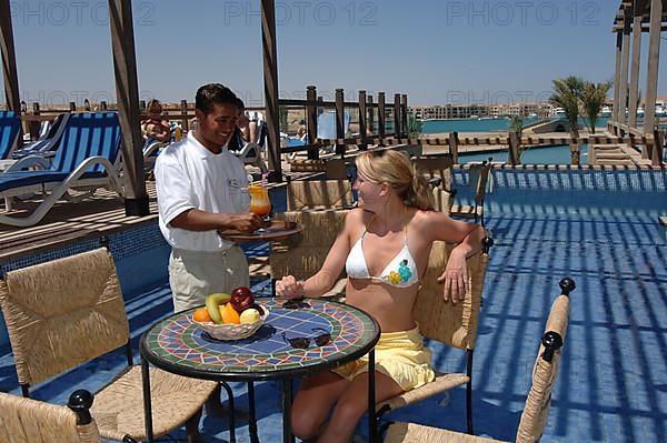 Young woman in pool bar